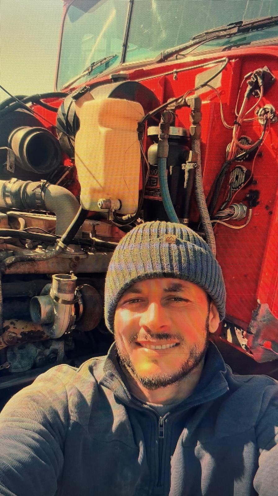 Mechanic working on a heavy-duty diesel engine